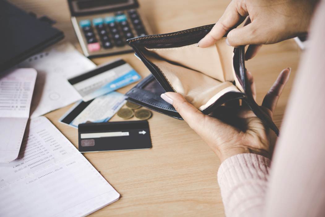 A person holding an empty wallet
AI-generated content may be incorrect.